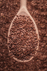 Flax seeds linseed on wooden spoon