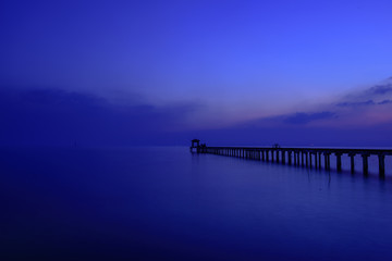 Fototapeta na wymiar Beautiful Wood bridge Twilight Sunset at Sea