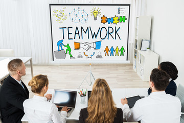 Businesspeople Working On Smart Goals Concept On Projector