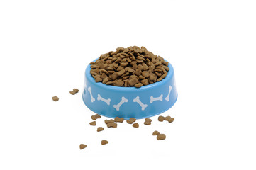 Dried pet food in blue bowl isolated on white background.