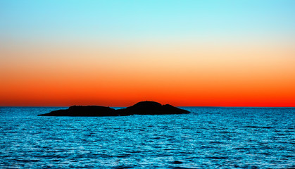 Fototapeta na wymiar Orange and Blue Night Seascape