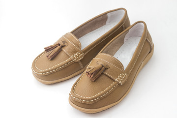 Pair of woman's leather shoes isolated on white background