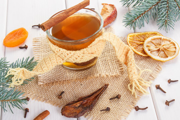 Spruce branches and traditional compote of dried fruits for Christmas