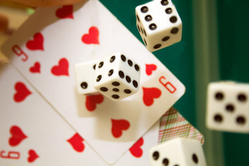 thrown into the air the dice and cards