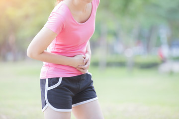 Fototapeta premium Sport girl have stomach pain