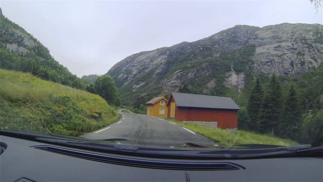 View from inside the car on the road. Forest. The mountains. Norway. Mountain scenery from the interior of the car