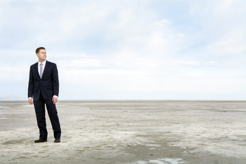 business man looking out over the bonniville salt flats