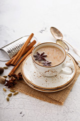 Masala tea in cup with winter spices