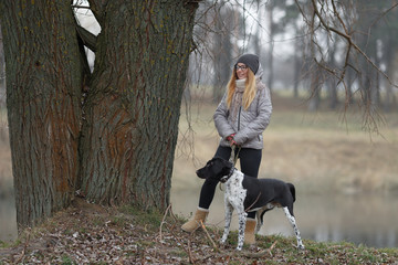 girl with a dog for a walk in the autumn