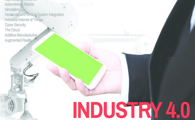 Industry 4.0 Bausiness man and mobile phone with green  screen Cyber The future revolution cyber physical systems of productivity and competitiveness