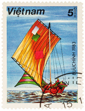 Old Asian sailing boat on postage stamp