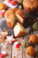 fruit bread panettone and christmas decoration close-up. vertical