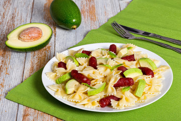 mini salami farfalle Pasta warm salad with avocado slices