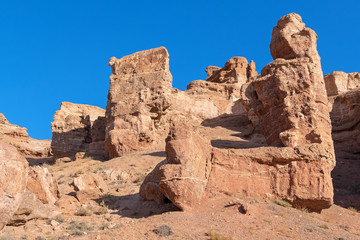Fototapeta premium Majestic cliffs on a background of blue sky. Charyn canyon, Kazakhstan.