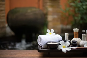 Poster Spa massage compress balls, herbal ball on the wooden with treaments spa , Thailand, select focus © freebird7977
