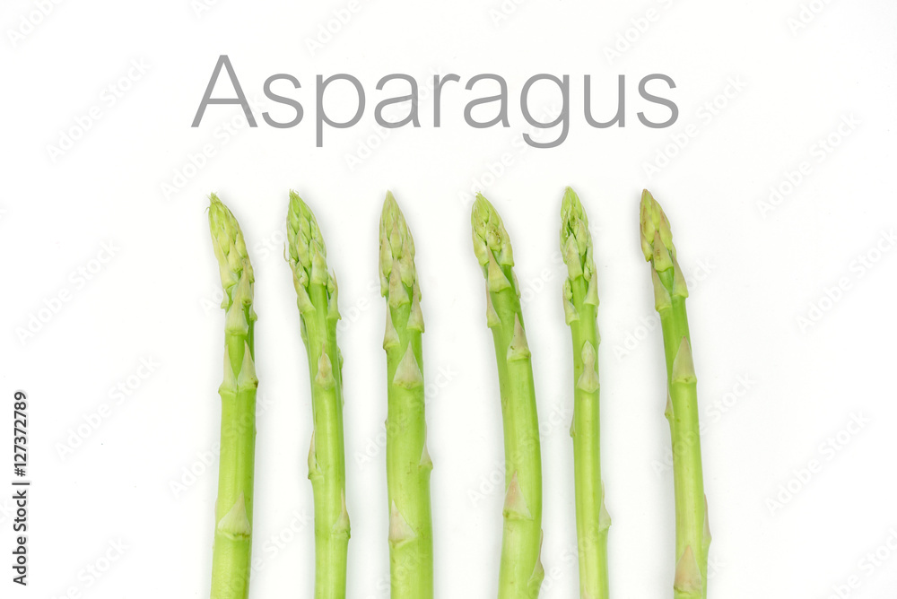 Wall mural fresh asparagus on white background