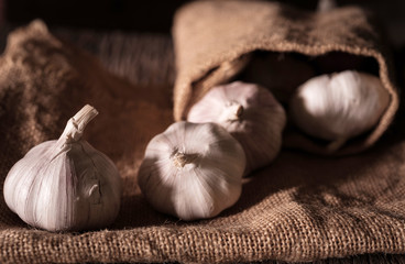 garlic bulbs with garlic cloves window light