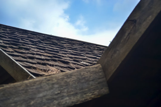 Picture of roof with sky in the background.