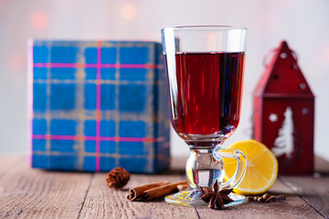Hot mulled wine with spices, gift box and candlestick 