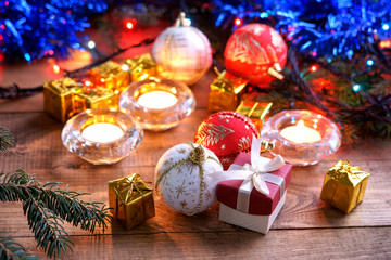 Christmas balls, gift boxes and candles 
