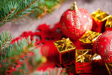 Christmas balls, gift boxes and fir tree branch 