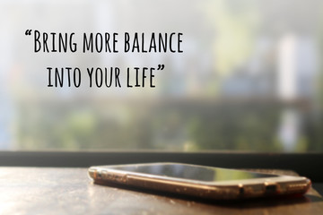 Inspirational quote "being more balance into your life" on blurr