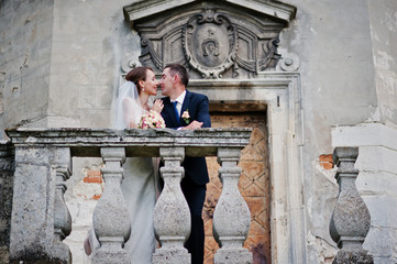 Wedding couple background old vintage castle. Happy newlyweds at