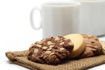 The chocolate cookies and coffee cup set for relax and break from meeting