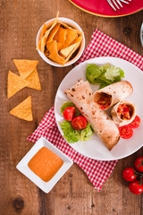 Tortilla wraps with chicken and vegetable. 