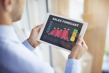 Sales forecast on digital tablet - obrazy, fototapety, plakaty