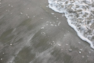 white sand on beach with wave