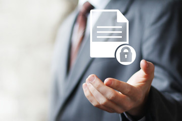 Businessman presses button security lock file document network
