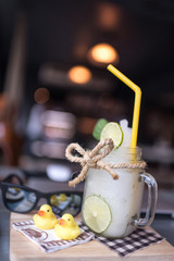 Lemonade Smoothie on table in coffee shop, selective focus.