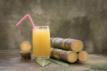 Piece of sugarcane juice over white background
