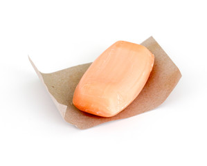 pink soap with aroma of peach on white background