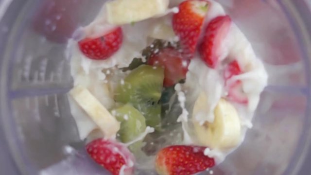 fruit mixing into blender seen from inside slow motion