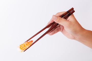 Sushi with chopsticks.