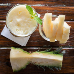 pineapple juice and pineapple smoothie on wood table. for health