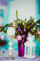 The vase with branches stand on the table