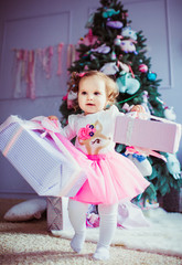 The small girl keeps presents