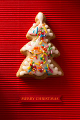 A postcard with a picture of a cookie Christmas tree