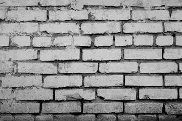 Peeled cold white brick wall texture background.
