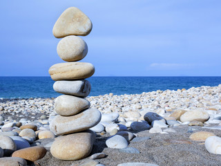 Fototapeta na wymiar Stones balance on beach, concept of harmony, rocks on the coast