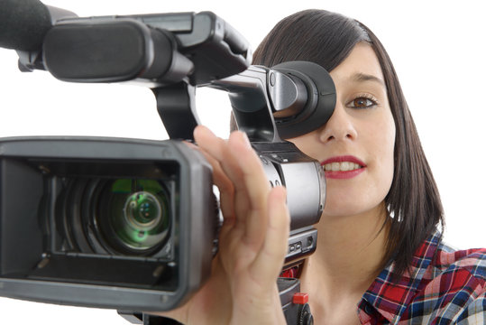 pretty young brunette girl with a professional camcorder, on whi