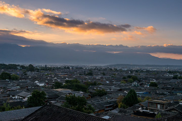 Top View of traditional roof with sunrise and dramatic effects at The Old Town of Lijiang is a UNESCO World Heritage Site located in Lijiang City, Yunnan, China.