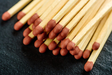 Household safety matches on dark background.