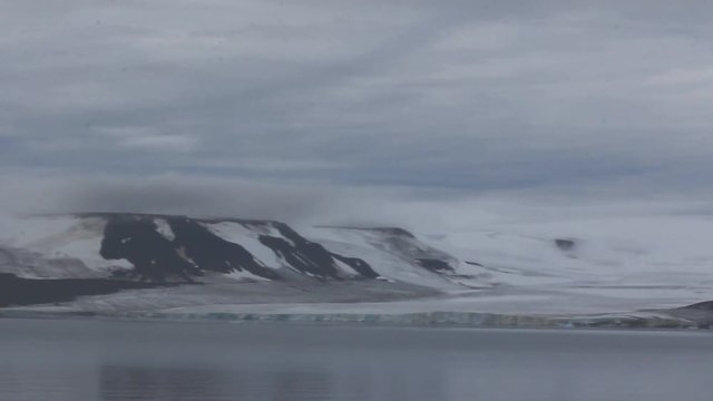 Harsh Arctic. Glaciers and destruction of ice mountains. Island Payer, Franz-Joseph Land. 
