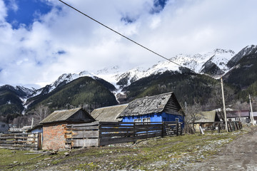 Blue wooden house in a mountain village
