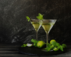 Martini or mint liqueur with lime, selective focus