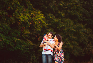 wonderful portrait of beautiful and happy parents with their cut